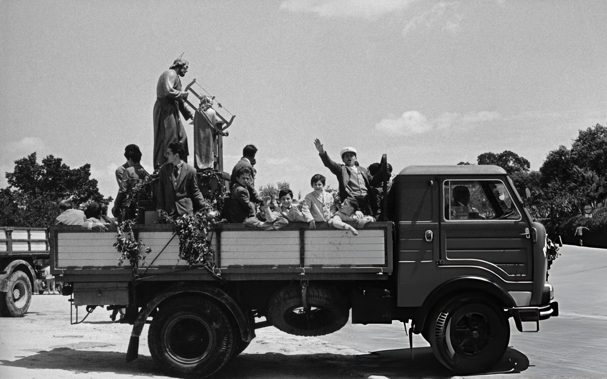 Children carrying a statue of Saint Joseph on a truck in Agrigento, 1950s