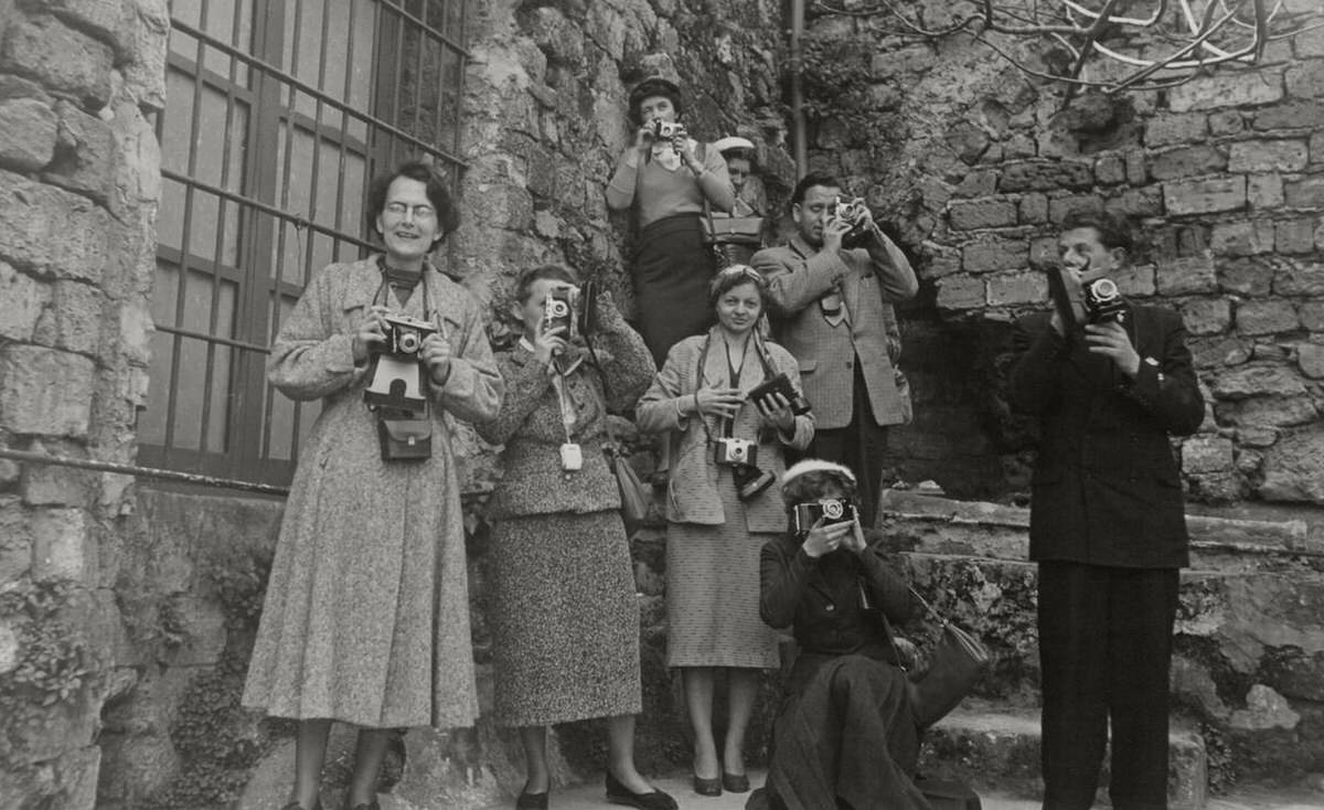 Camera Club members taking photographs of a tourist site in Sicily, 1940s