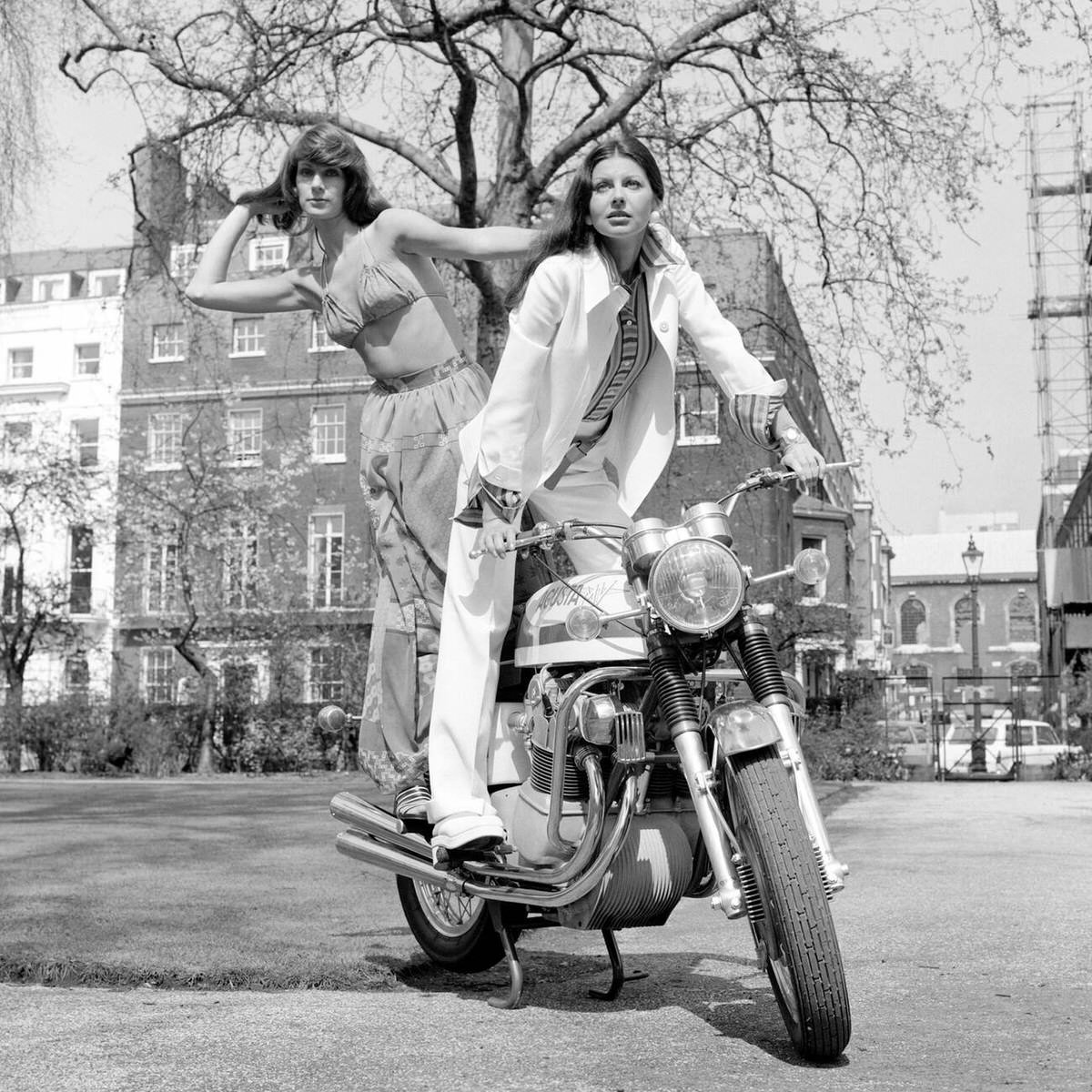Misty and Selina on an MV Agusta 750cc Sport motorcycle, 1973