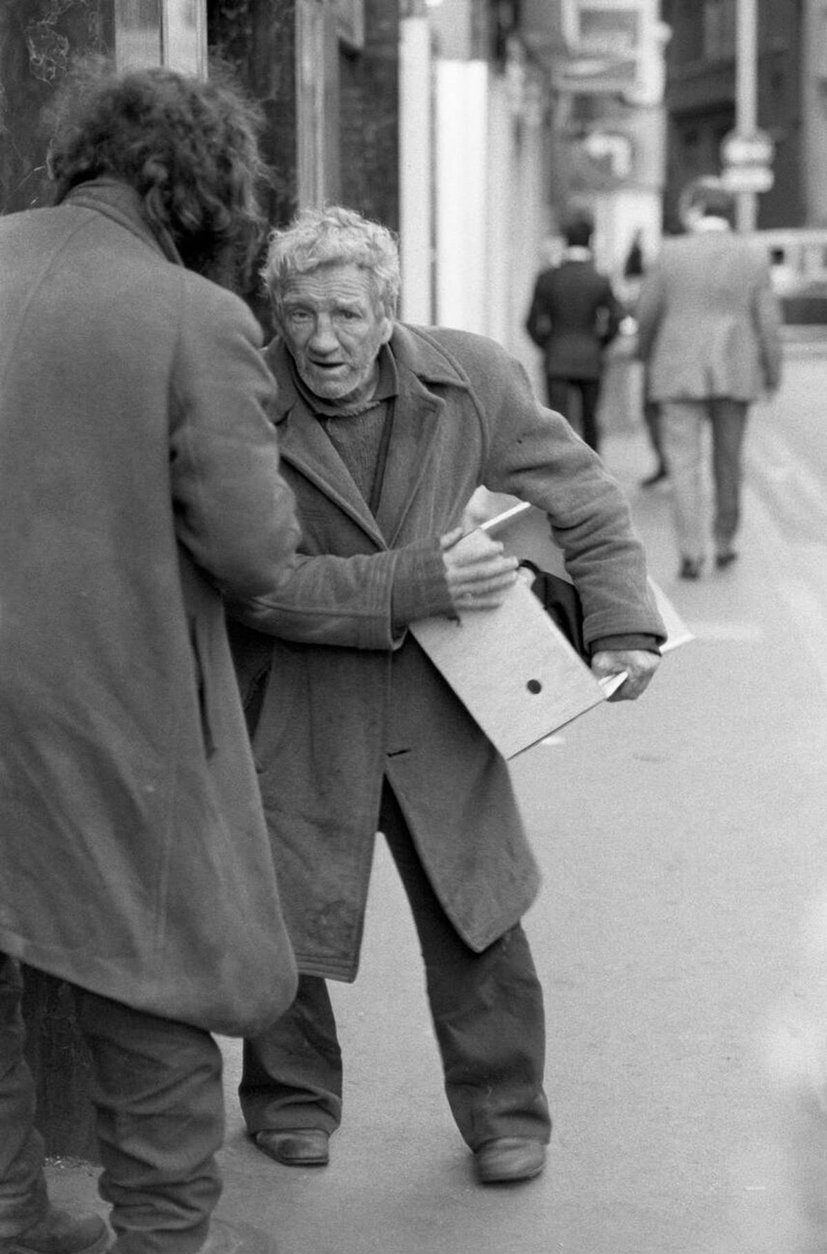 Two tramps chatting in a Soho street, 1977
