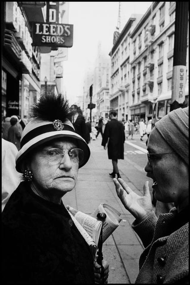 Women talking on a downtown street in San Francisco, 1963