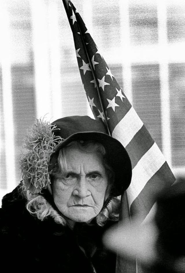 Woman on a float with the American flag during a Fourth of July parade in San Francisco, 1963