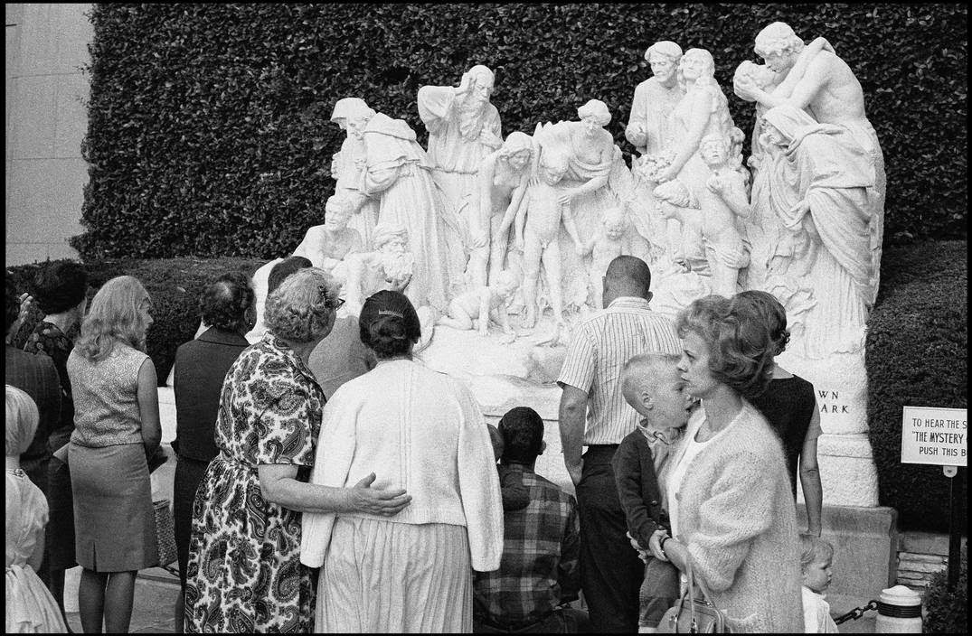 Tourists visiting a sculpture exhibition in Forest Lawn Cemetery, Los Angeles, 1963