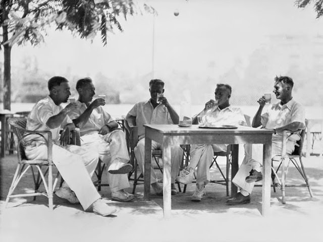 Cricketers take refreshment under (late) summer skies