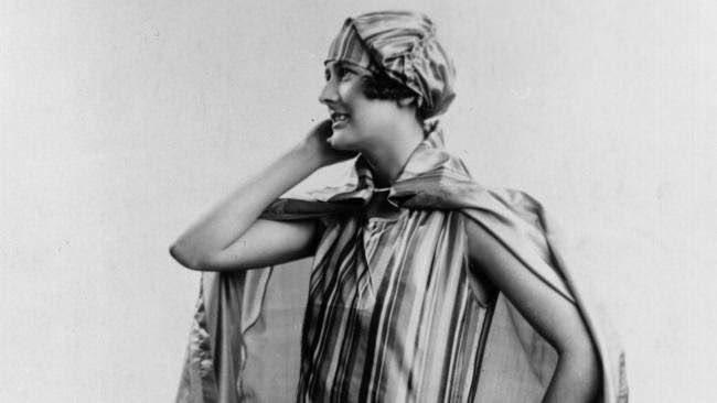 Model wearing a striped taffeta beach ensemble, 1928