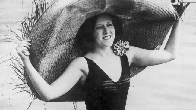 Model wearing a straw hat and bathing costume, 1923