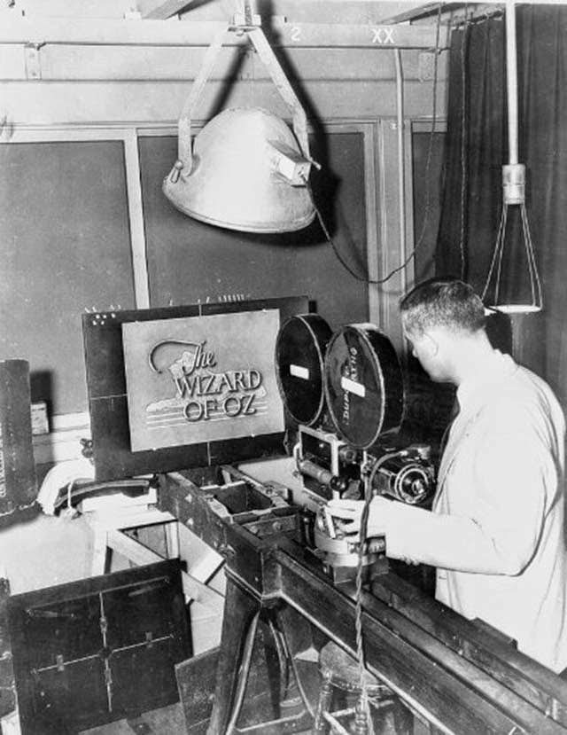 Technician photographing a rejected opening title concept, The Wizard of Oz, 1939