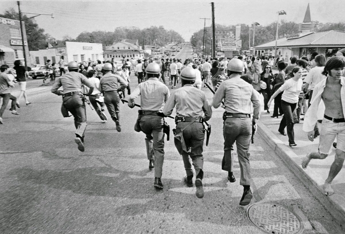 Police charge south on U.S. Route 1 on May 1, 1970 to clear the highway of students protesting President Richard Nixon’s expansion of the Vietnam War into Cambodia.