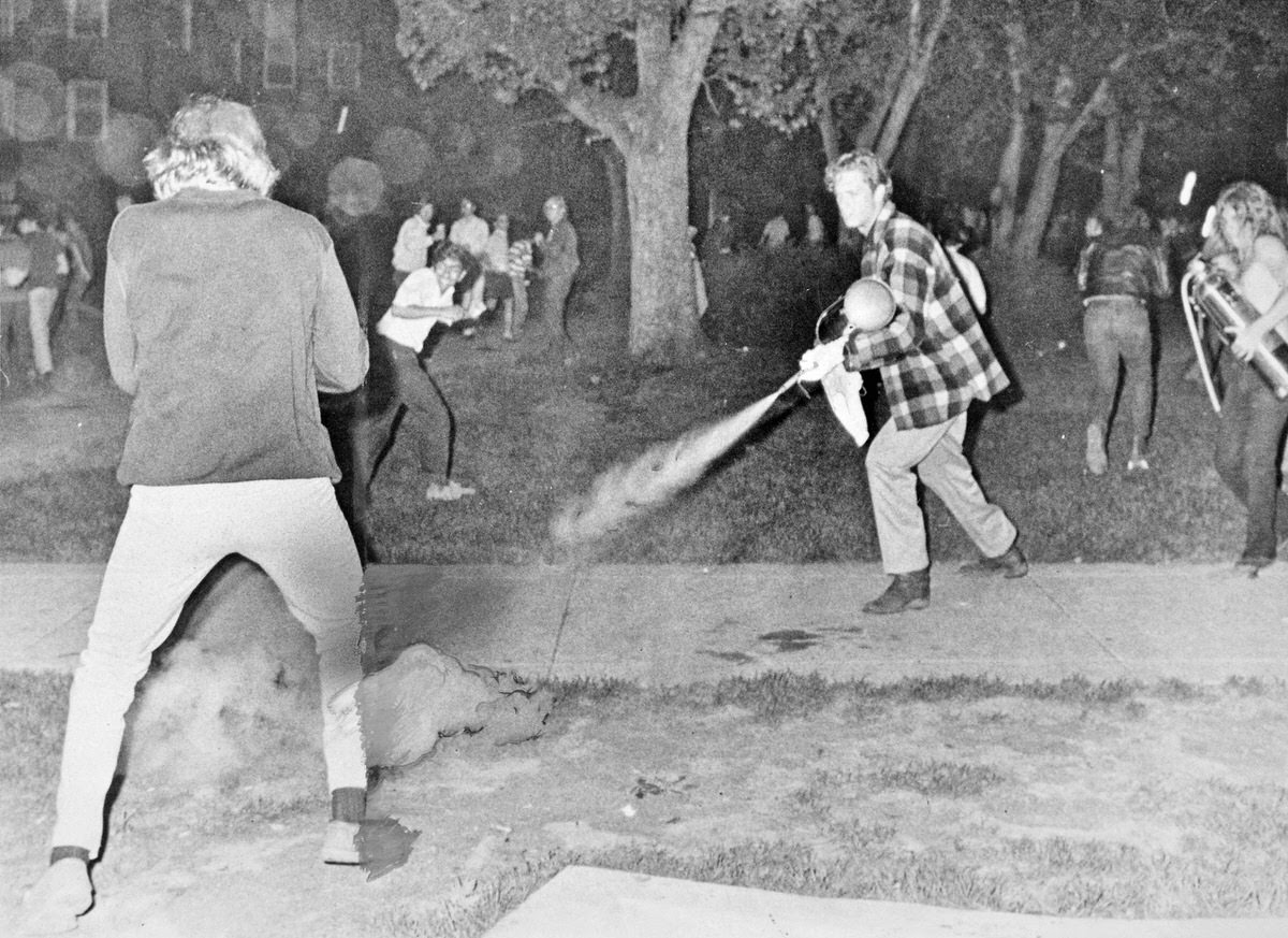 Students grab fire extinguishers to suppress tear gas canisters fired at them by police May 1, 1970 during a demonstration at the University of Maryland protesting the expansion of the Vietnam War into Cambodia.