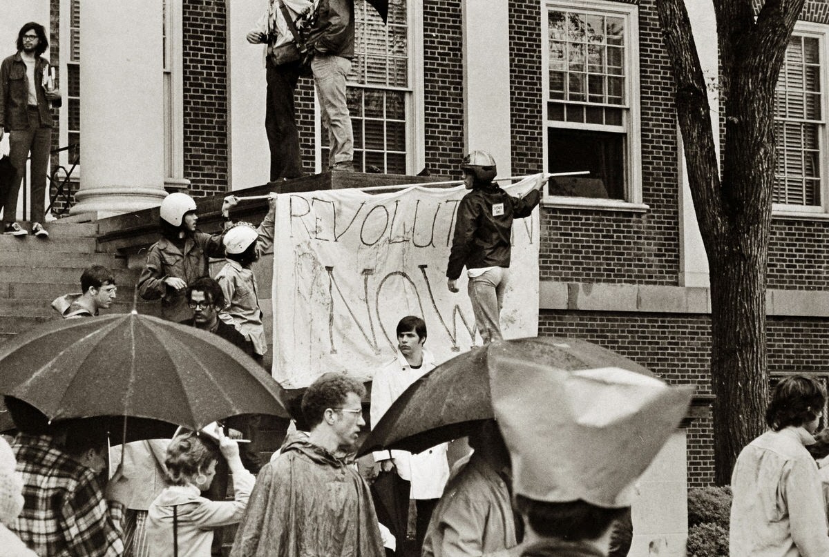 Students raise banner for revolution May 4, 1970 on the steps of the University of Maryland main administration building after President Richard Nixon invaded Cambodia and the Ohio National Guard killed four student demonstrators at Kent State University.