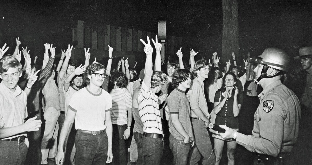 University of Maryland students confront police outside Skinner Hall in the late night hours of March 23, 1970. Police moved in to arrest 87 students occupying the building in the early morning hours of March 24.