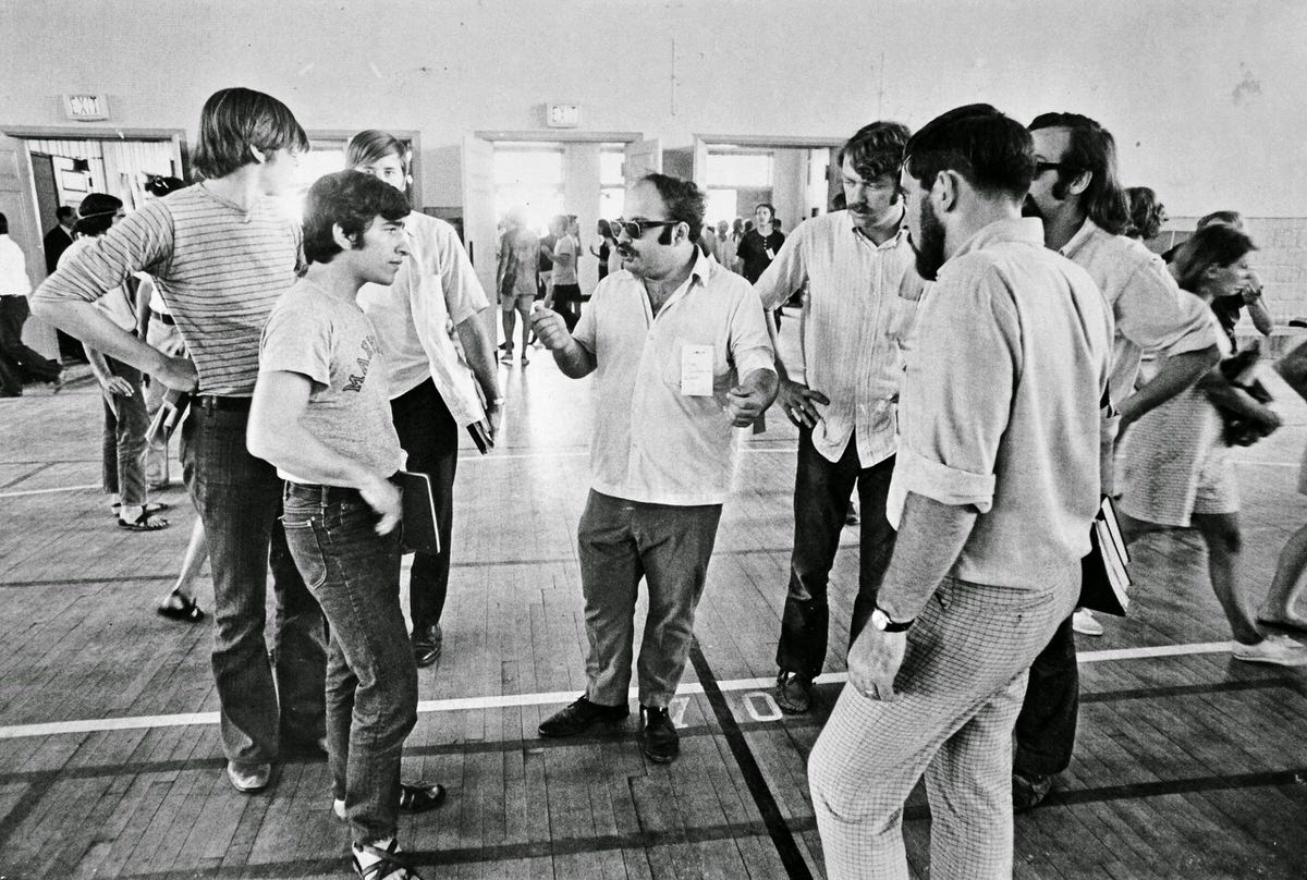 A man identified only as a chemistry professor argues with students over tactics for demonstrating against the Indochina War on May 11, 1970 inside Cole Field House on the University of Maryland campus.