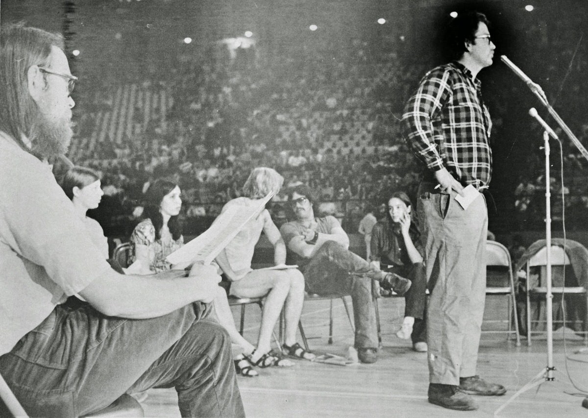 Gregory Dunkel, a University of Maryland alumnus with a PhD in mathematics, urges a crowd of over 3,000 students gathered at Cole Field House on May 11, 1970 to takeover the ROTC building on campus in protest of the expansion of the Indochina War.