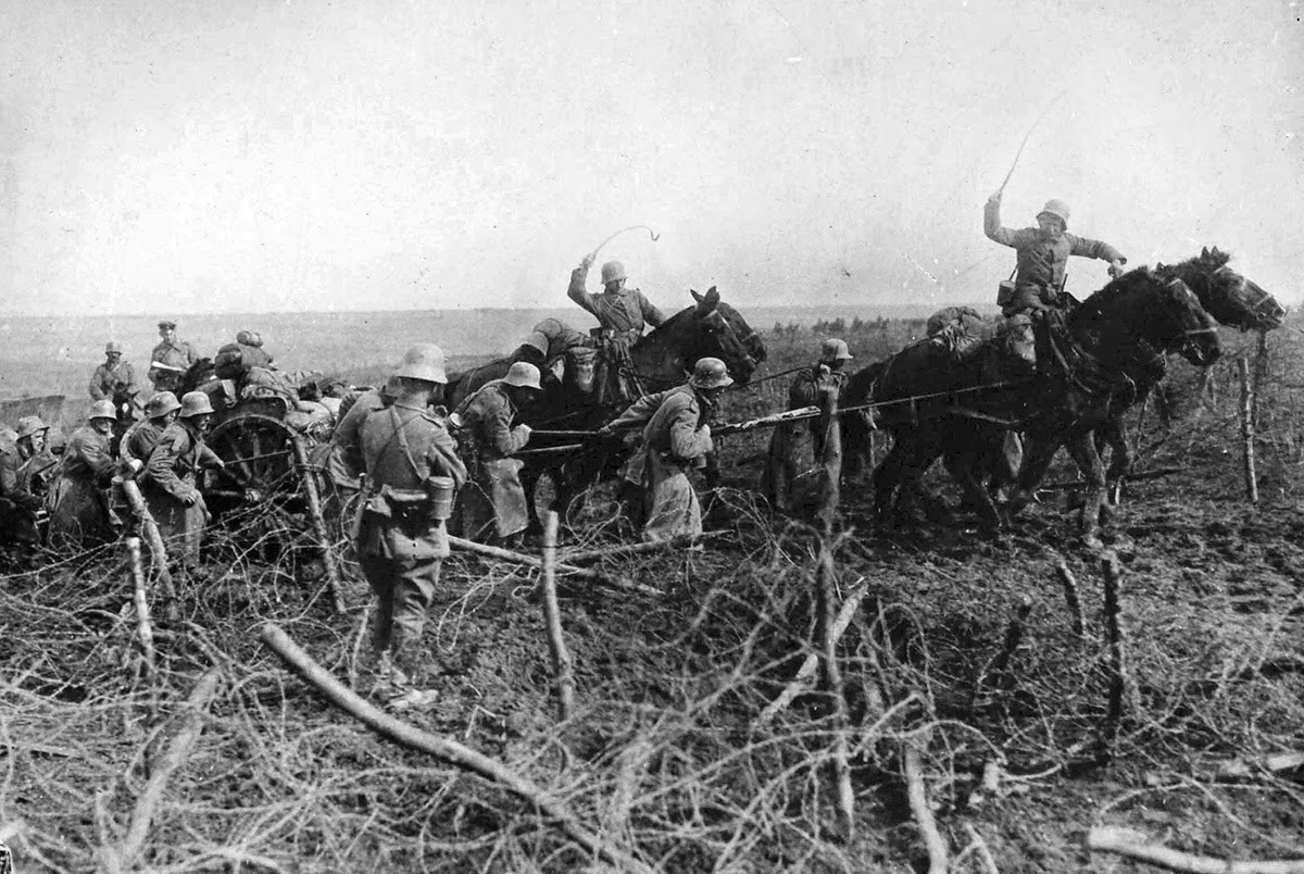 Horse-drawn artillery advancing through captured British positions west of St. Quentin, 1918