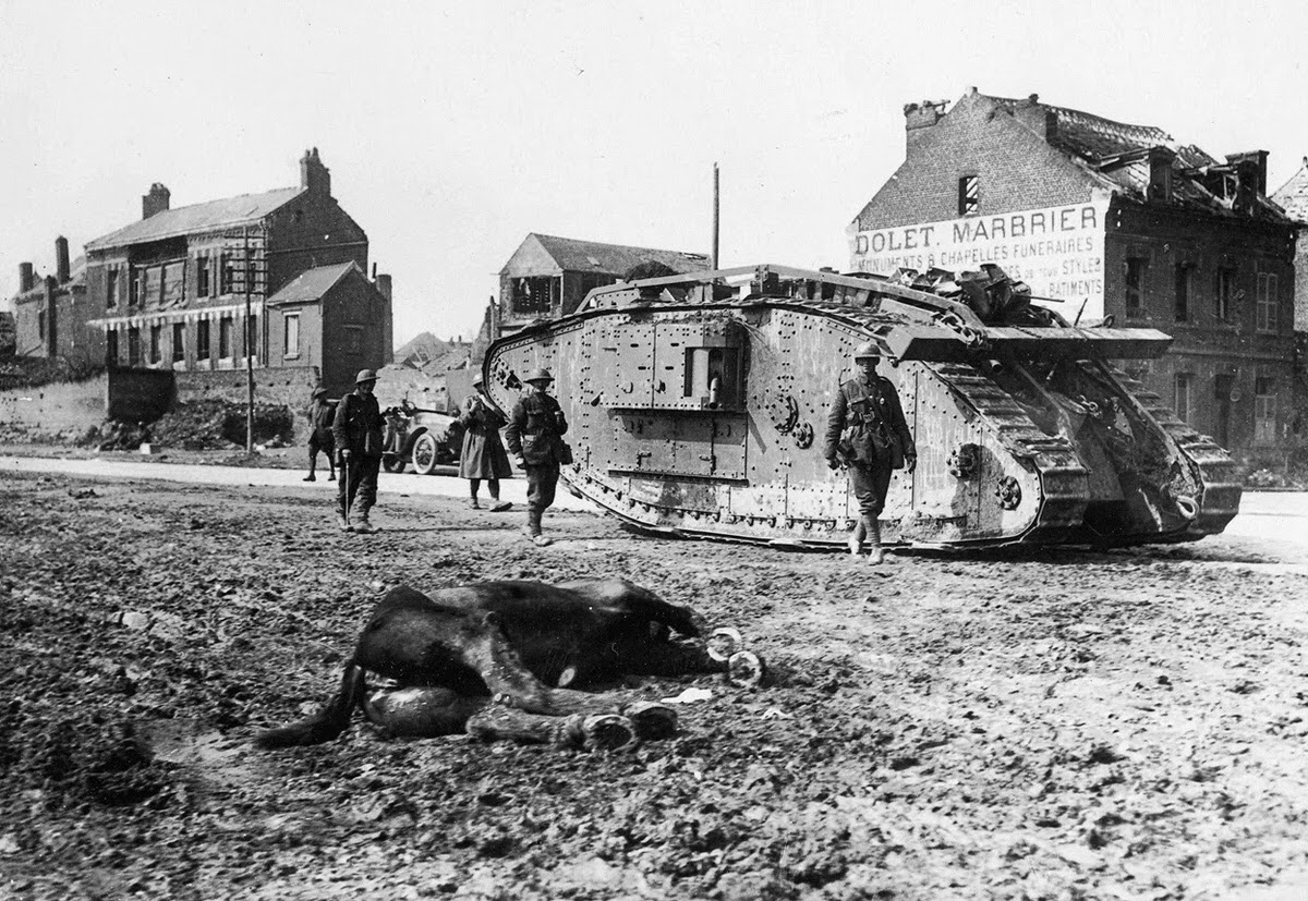 British Mark V tank passing a dead horse in Peronne, France, 1918