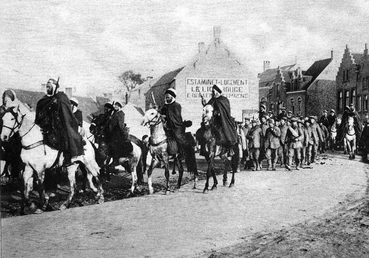 Algerian cavalry escorting German prisoners in western Belgium, 1914