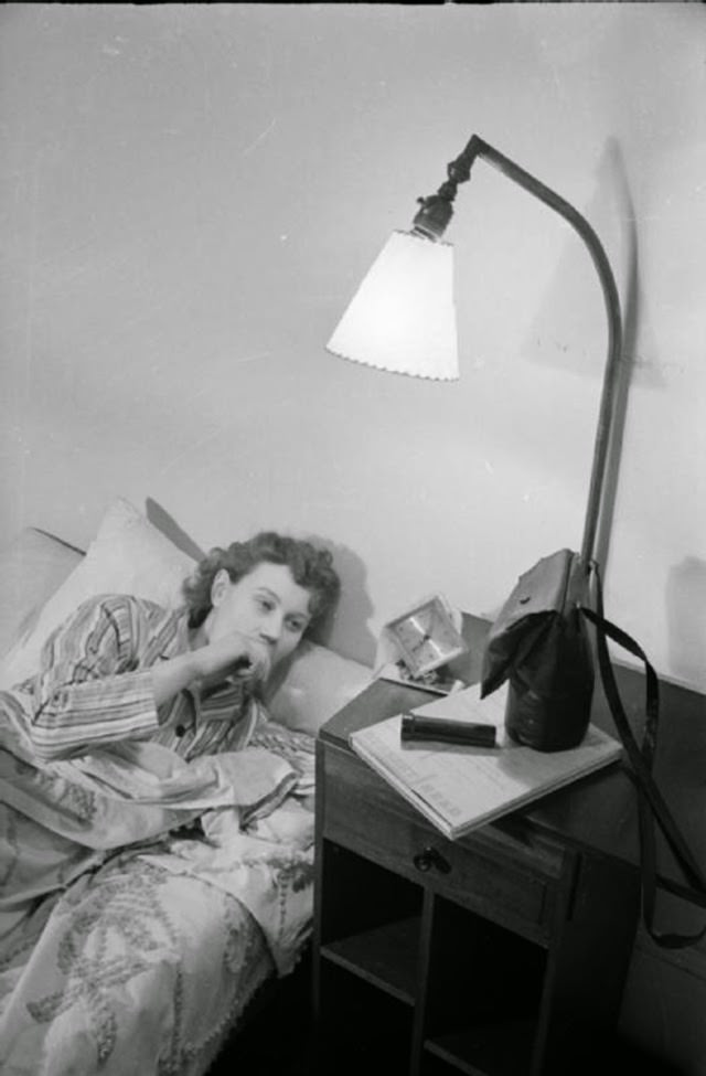 Mrs Day wakes up at 7am at her home in Drayton Gardens, South Kensington. On the bedside cabinet, her gas mask, torch and a book are ready, in case a quick dash to the air raid shelter is required in the night.