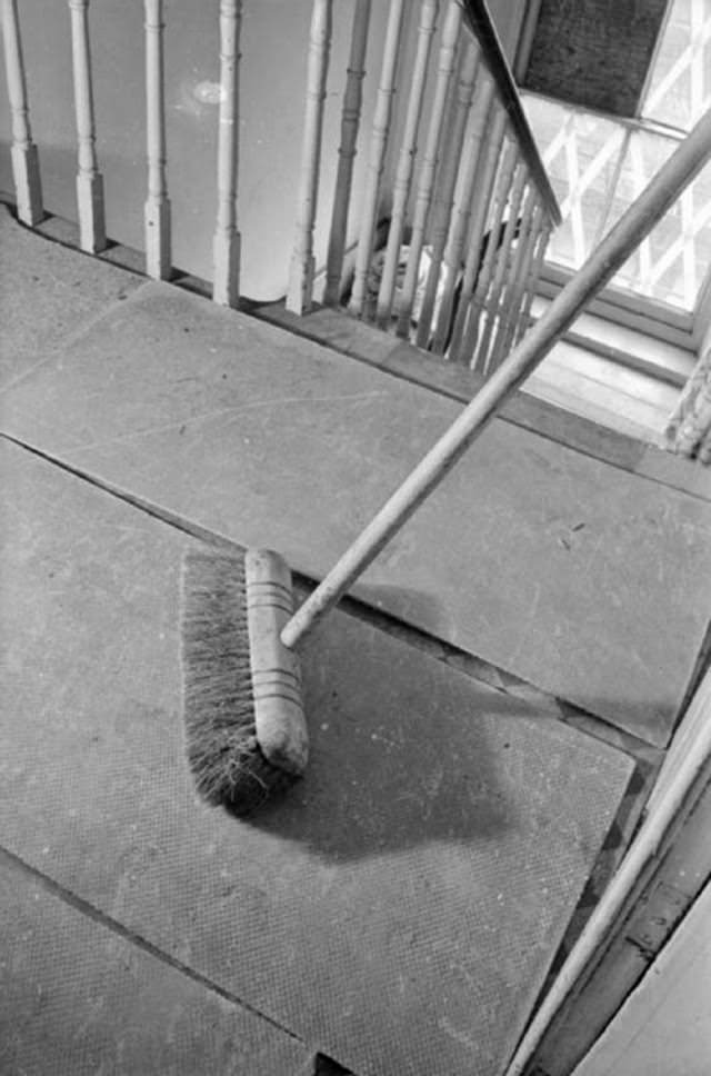 This photograph shows how large sheets of asbestos have been laid on the landing at the top of Mrs Day’s home to try to prevent fires from incendiary bombs from spreading to other parts of the house.