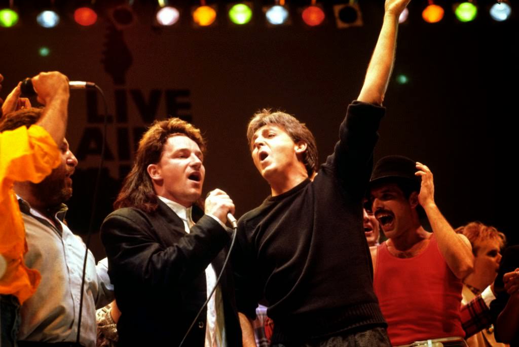 Bono of U2, Paul McCartney, and Freddie Mercury of Queen during the finale of Live Aid, 1985