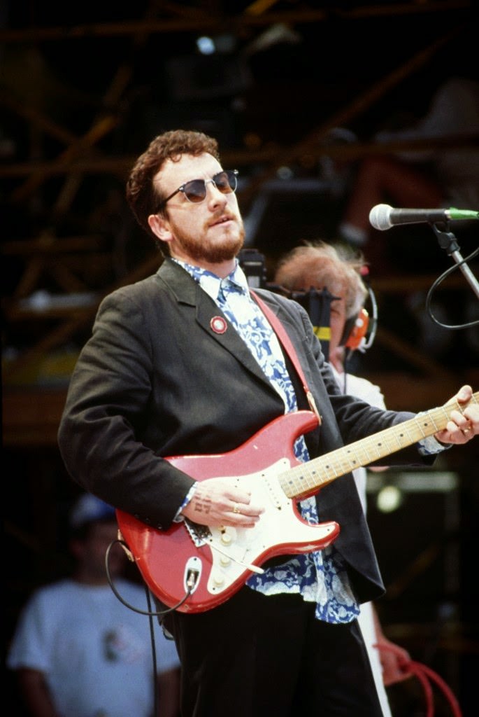 Elvis Costello performing on stage at Live Aid, 1985