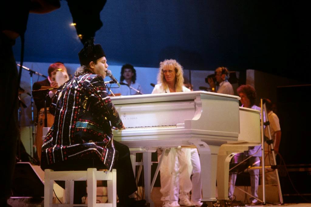 Elton John at the piano during the Live Aid concert, 1985