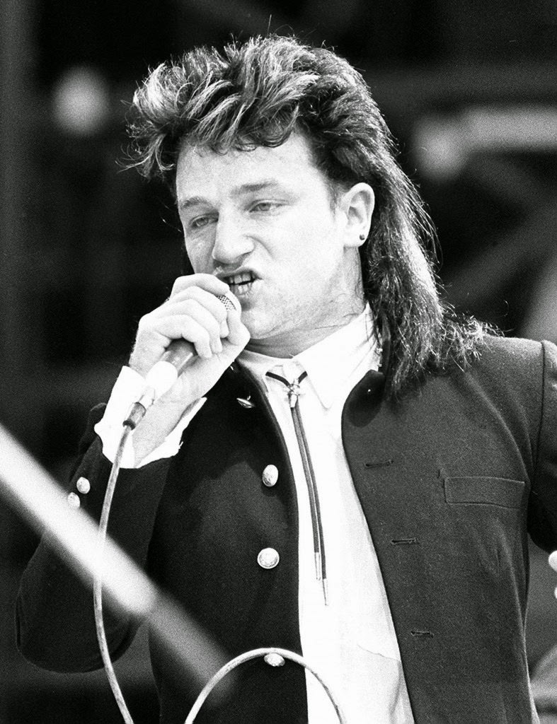 Bono of U2 performing at the Live Aid concert, 1985