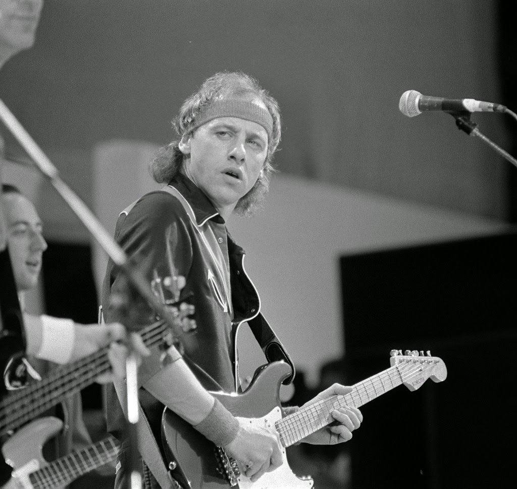 Mark Knopfler of Dire Straits performing at the Live Aid concert, 1985