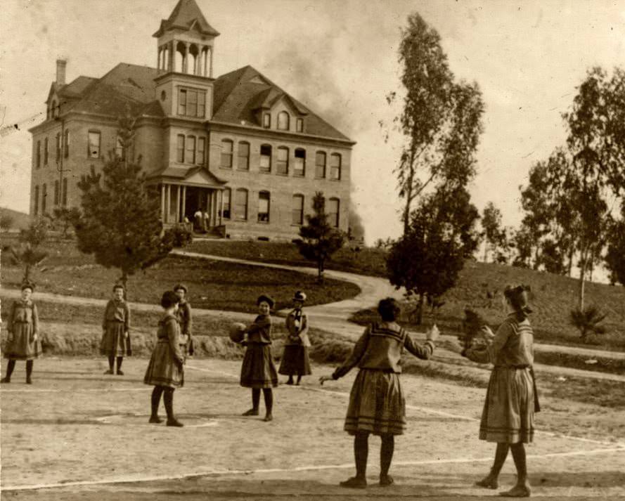 Whittier College girls' basketball team in front of Founders Hall, 1900