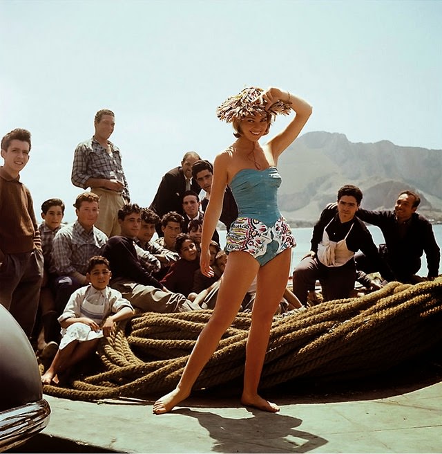 Lilli Cerasoli wearing a one-piece swimsuit with a whalebone bustier and culottes in printed cotton with a straw hat, 1950s