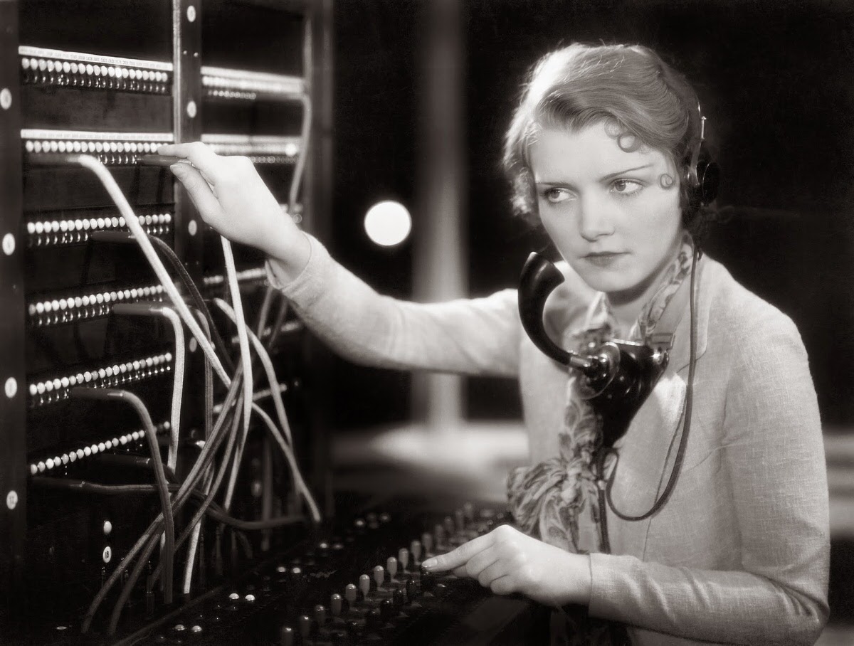Young woman working as a telephone operator, 1930s