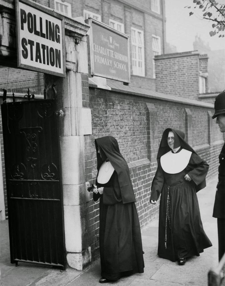 Nuns arriving at a polling station, 1959