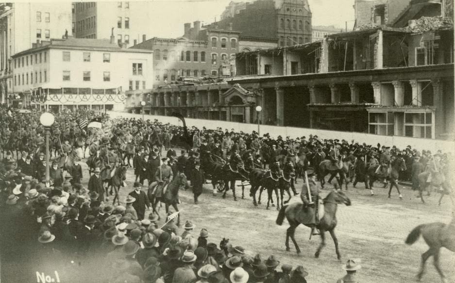 President Wilson and his coterie parade through Paris.
