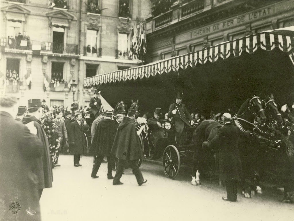 Wilson traveling with his party through Paris, France.