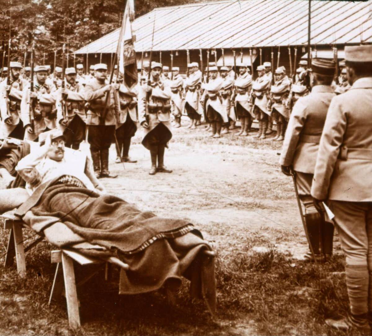 Wounded officer saluting the flag, 1910s