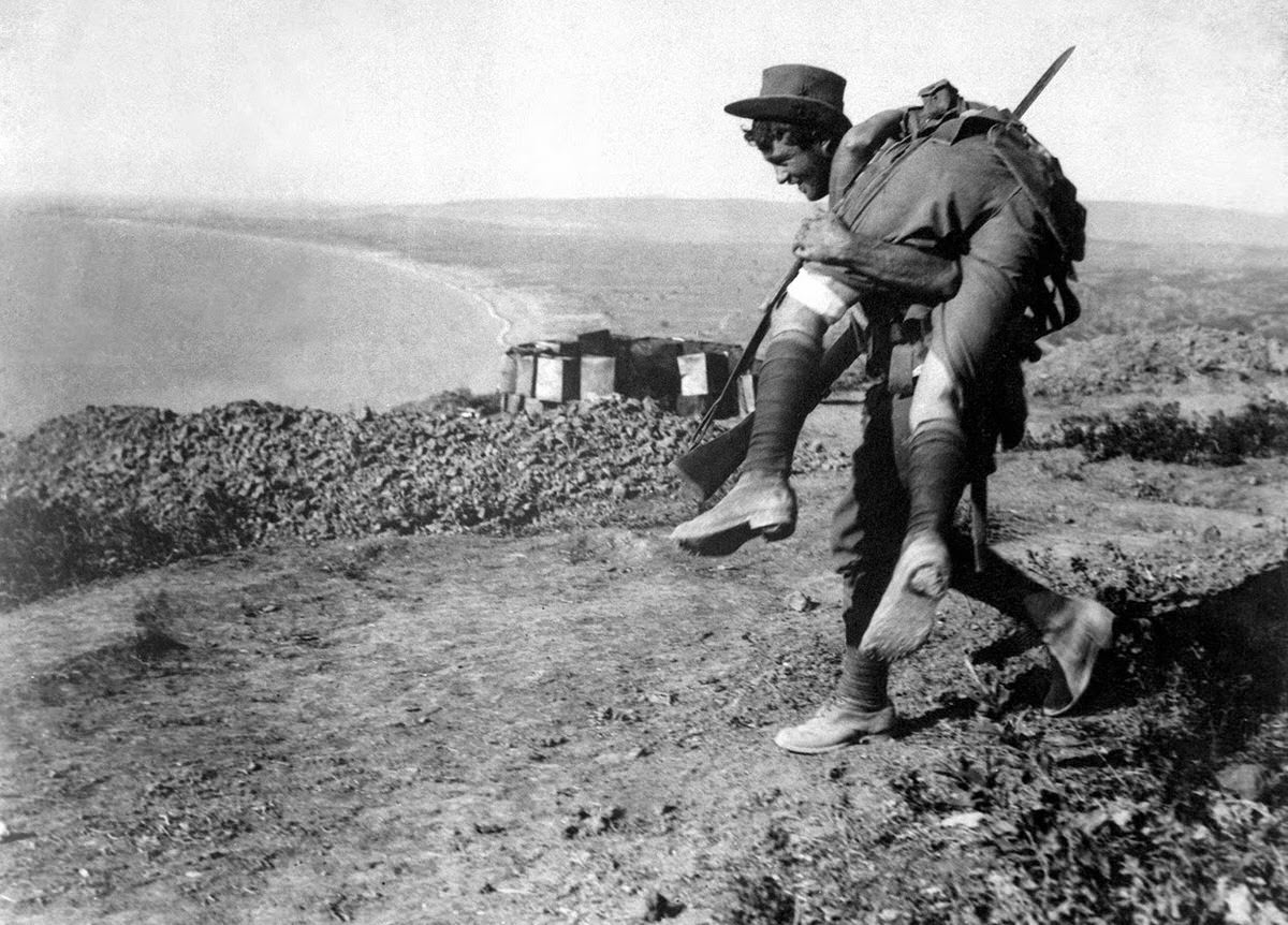 Australian soldier bringing a wounded comrade to a hospital during the Dardanelles campaign, 1915