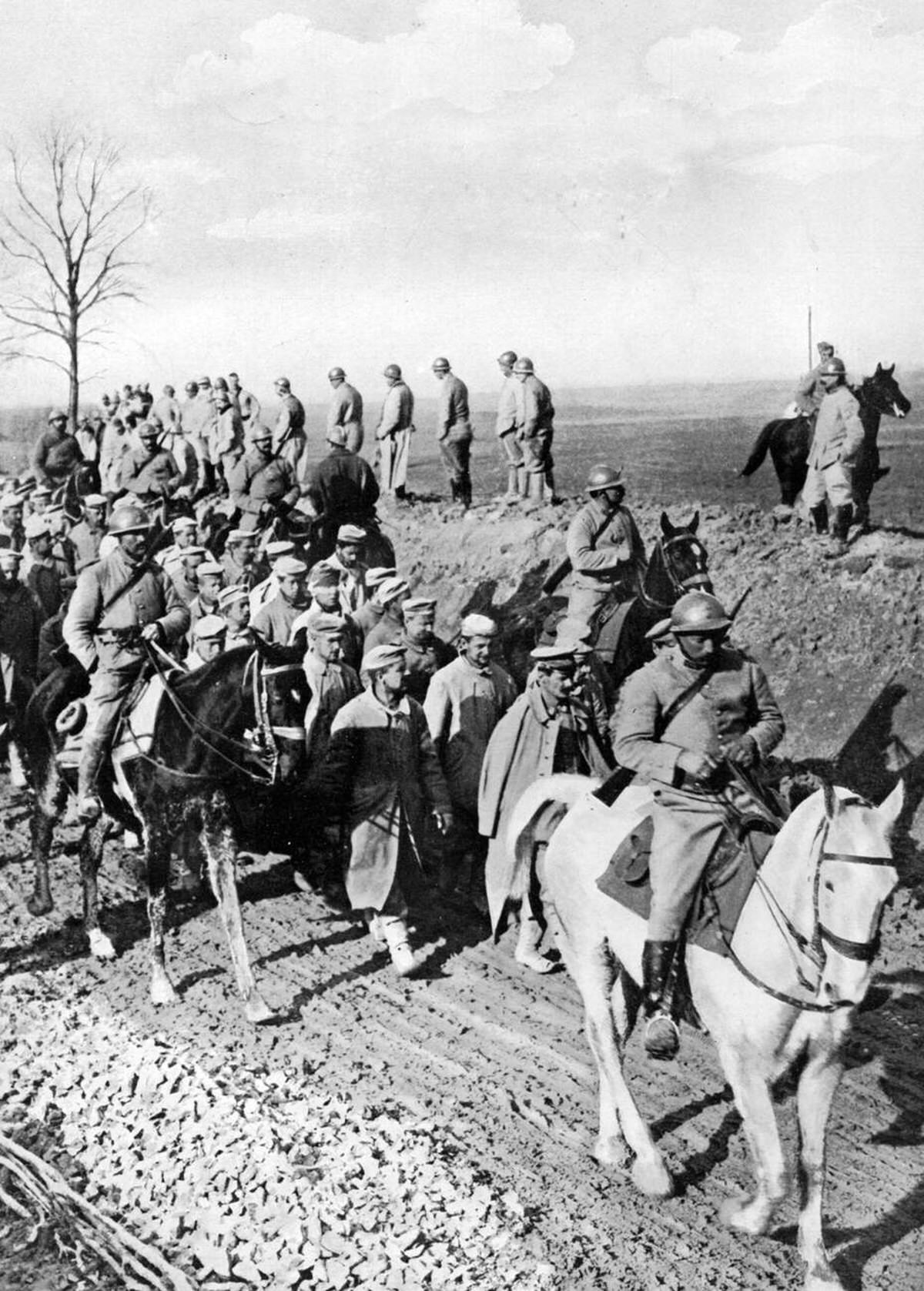 German prisoners from the Somme battlefield with a mounted escort, 1916
