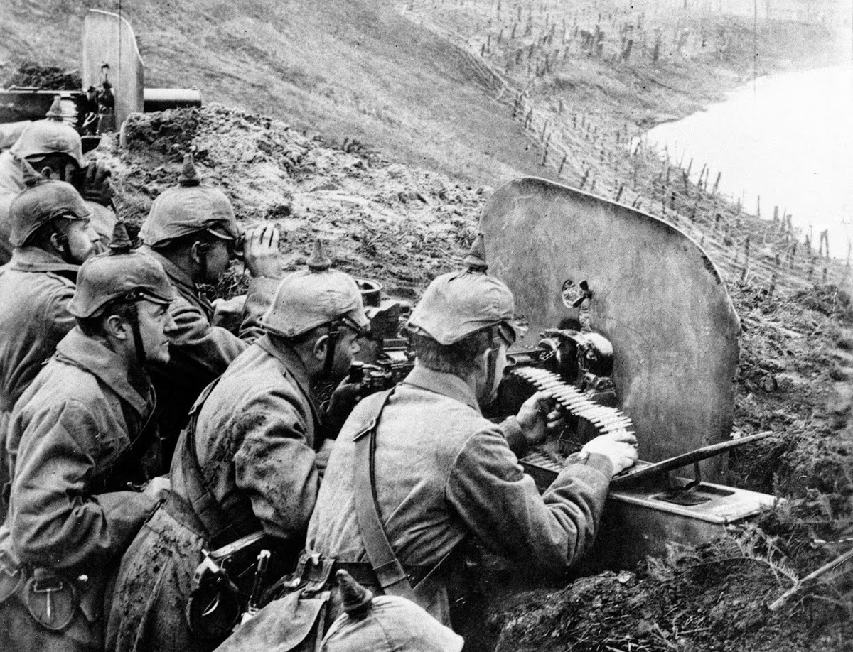 German infantrymen aiming machine guns from a trench on the Vistula River, 1916