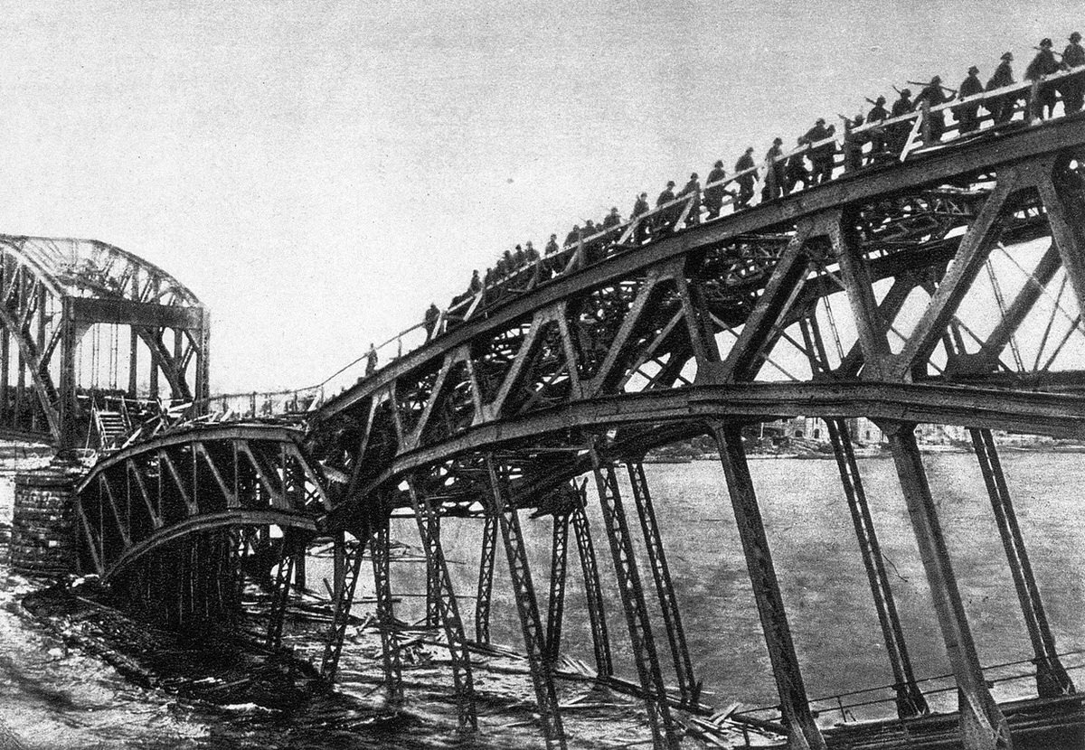 Makeshift walkway built by German engineers over a demolished railroad bridge near Riga, Latvia, 1914