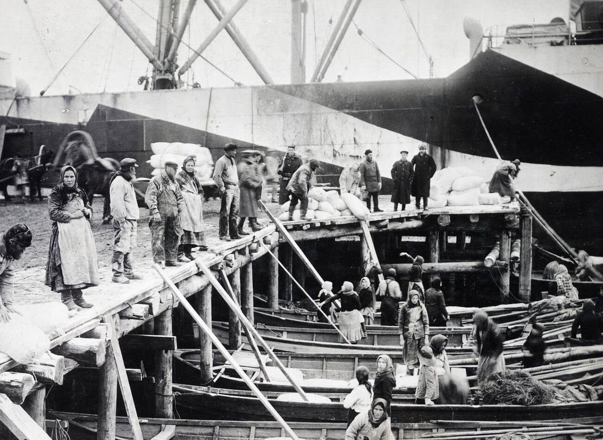 Russian women unloading supplies from a transport in Siberia, 1910s