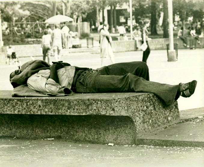 Person napping during the summer in Washington Square Park, Greenwich Village, New York City, 1977