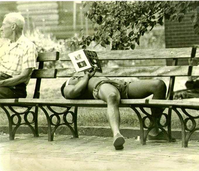 Person reading during the summer in Washington Square Park, Greenwich Village, New York City, 1978