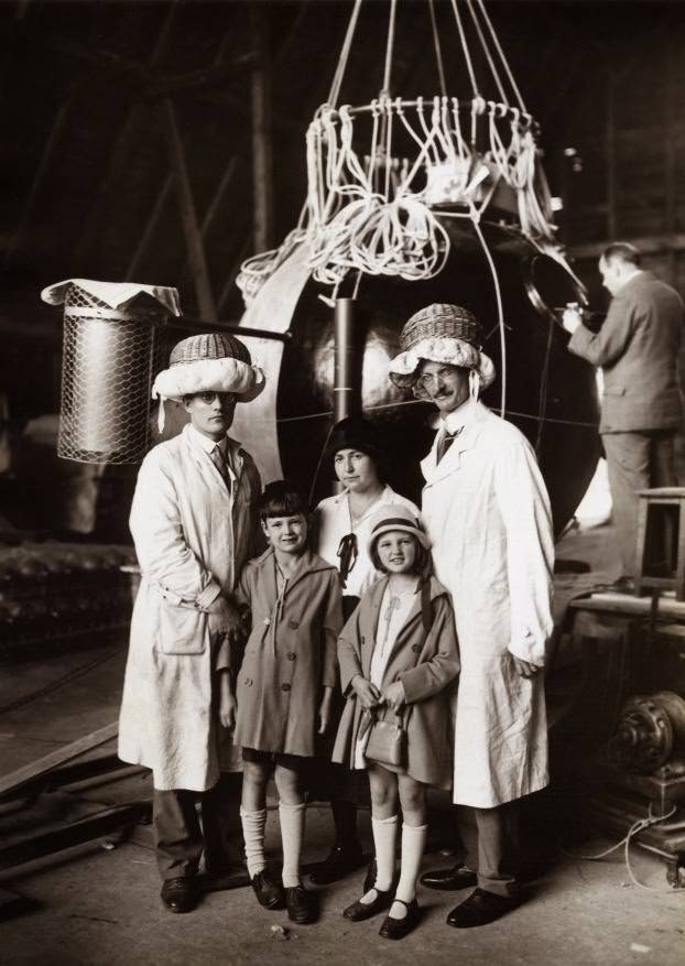 Professor Auguste Piccard and family with engineer Kipfer in front of a stratospheric balloon capsule, 1931