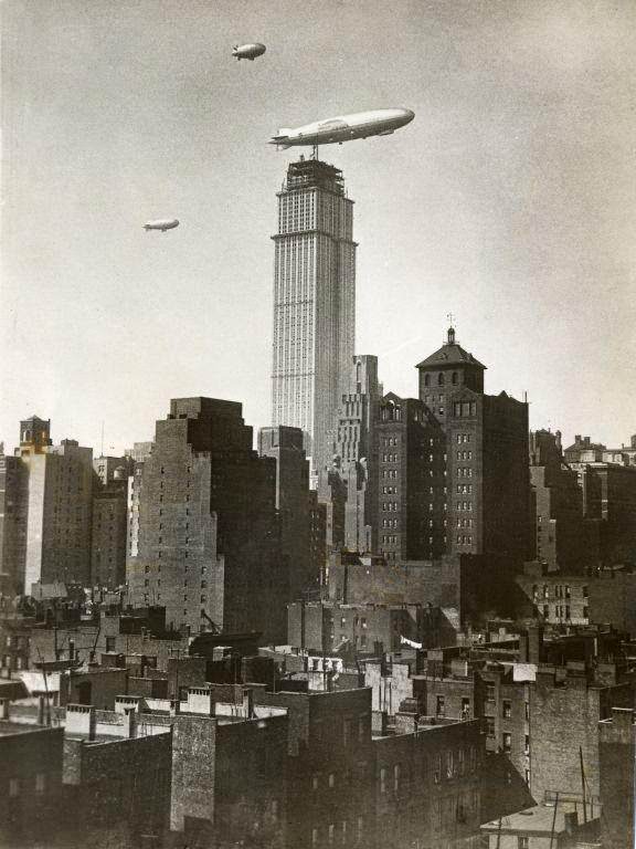 American airship ZR-3 Los Angeles flying near the Empire State Building under construction, 1930
