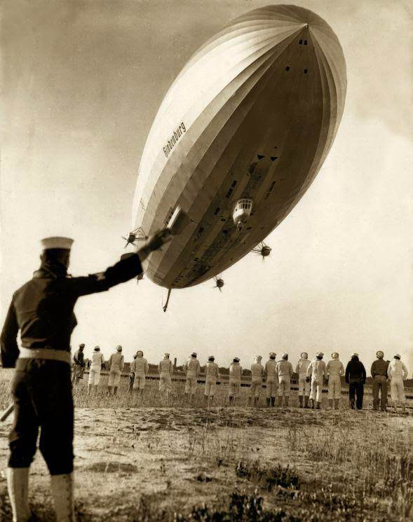 Marine waving to a friend on the German zeppelin Hindenburg at Lakehurst, New Jersey, 1936