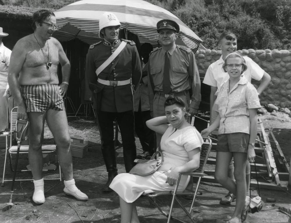 Director Cy Endfield dressed for the South African heat in short shorts. Endfield had previously directed Stanley Baker (second left) in the cult truck-driving thriller Hell Drivers (1957).