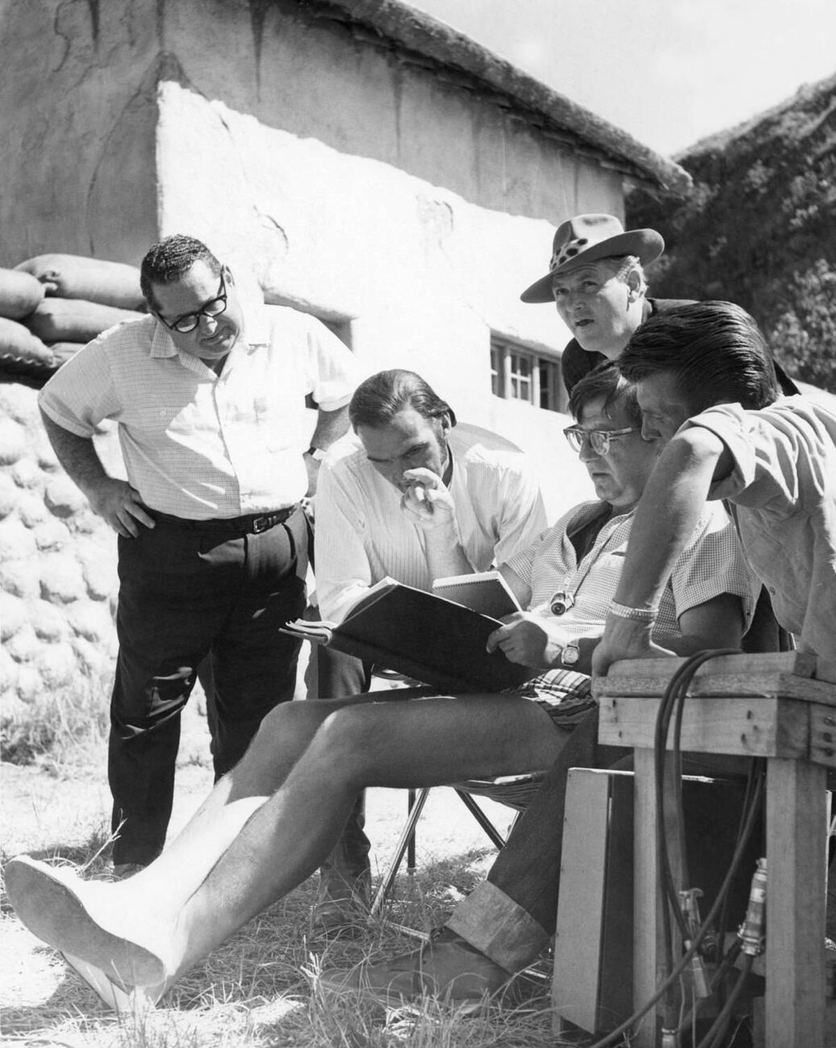 Stanley Baker, Joseph E. Levine, Bob Porter, Cy Endfield, and John Sullivan on location, Zulu, 1964