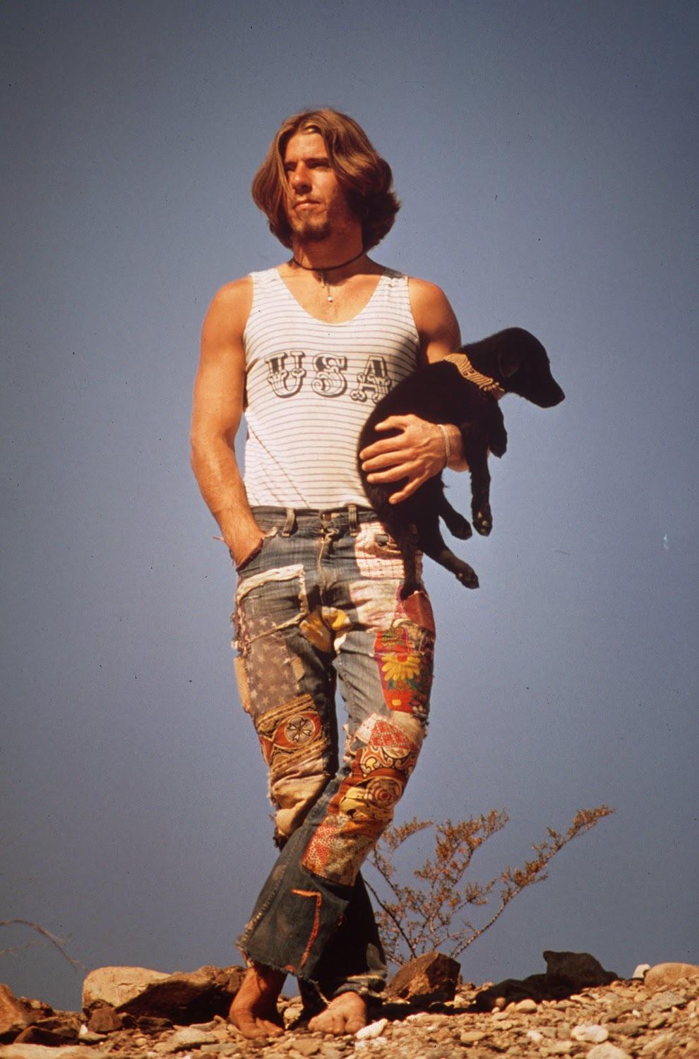Hitchhiker with his dog, 'Tripper,' on U.S. 66. U.S. 66 crosses the Colorado River at Topock, Mohave County, Arizona, 1972