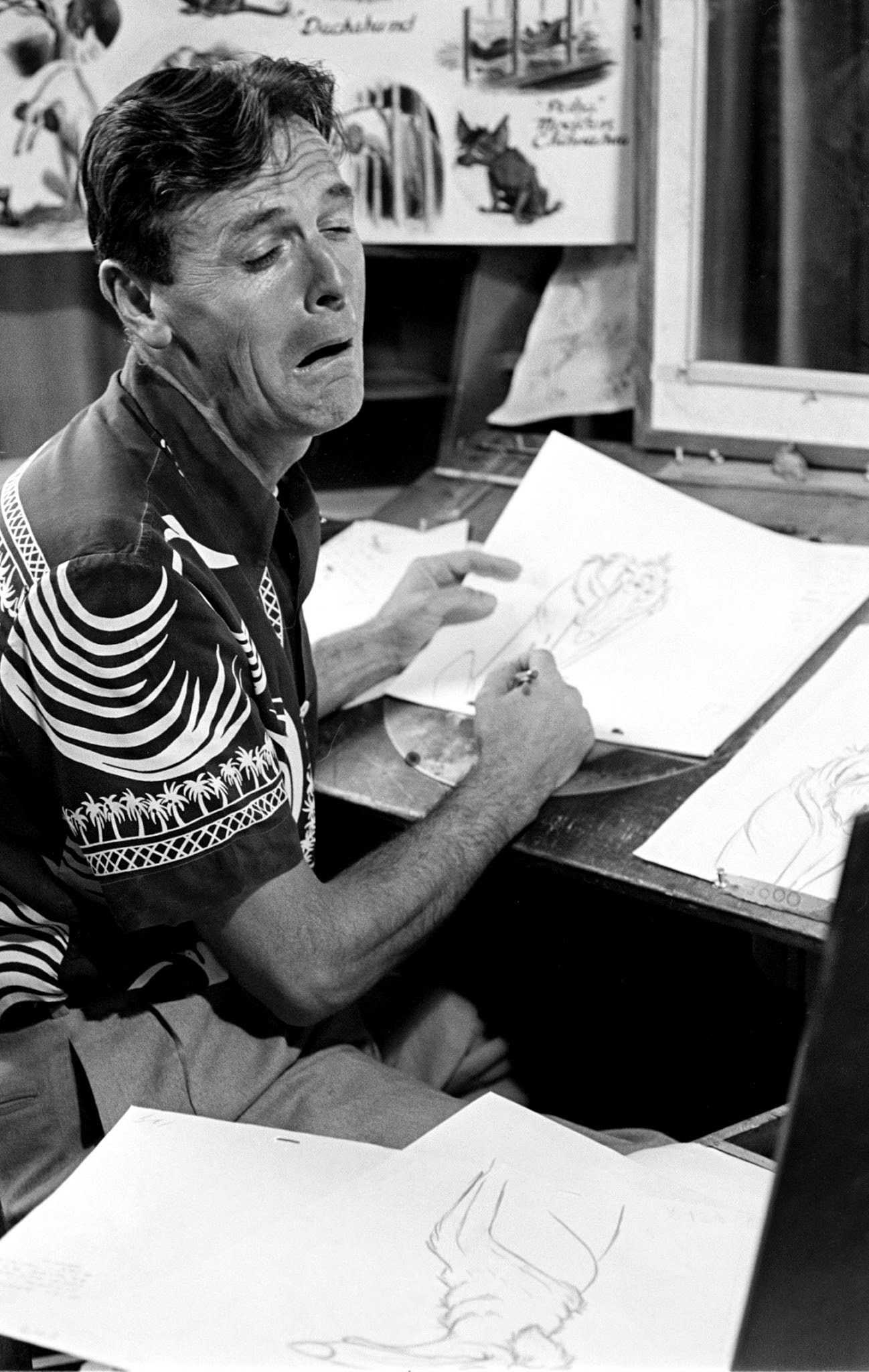 Disney animator peers in a mirror to get facial expressions just right, 1950s