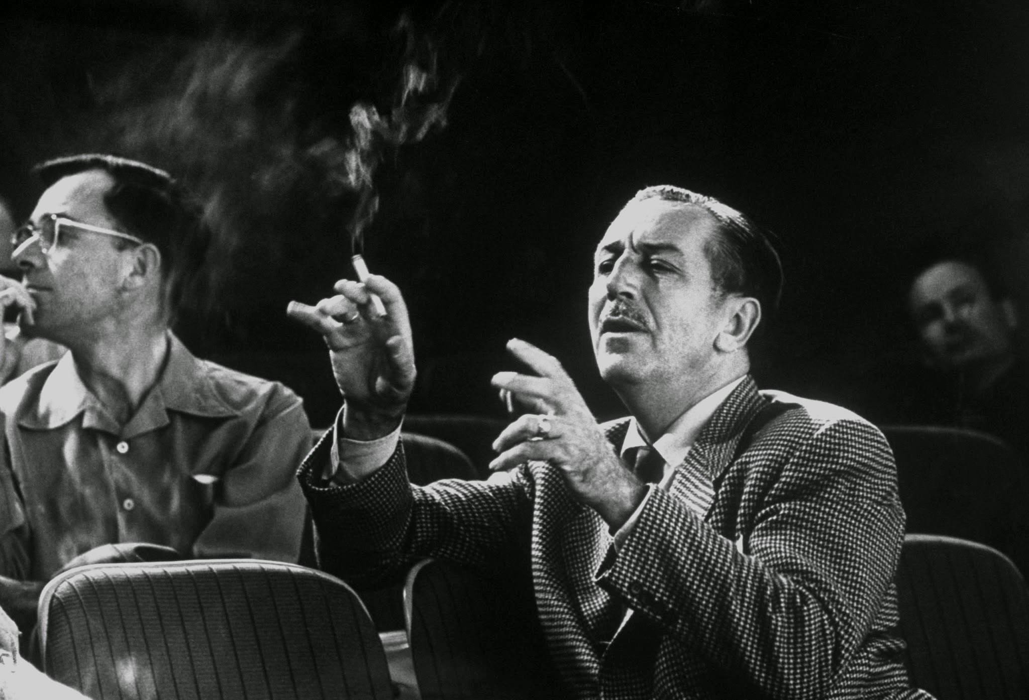 Walt at work gives animated version of what he thinks action ought to look like as he directs story conference on his forthcoming Sleeping Beauty, 1950s