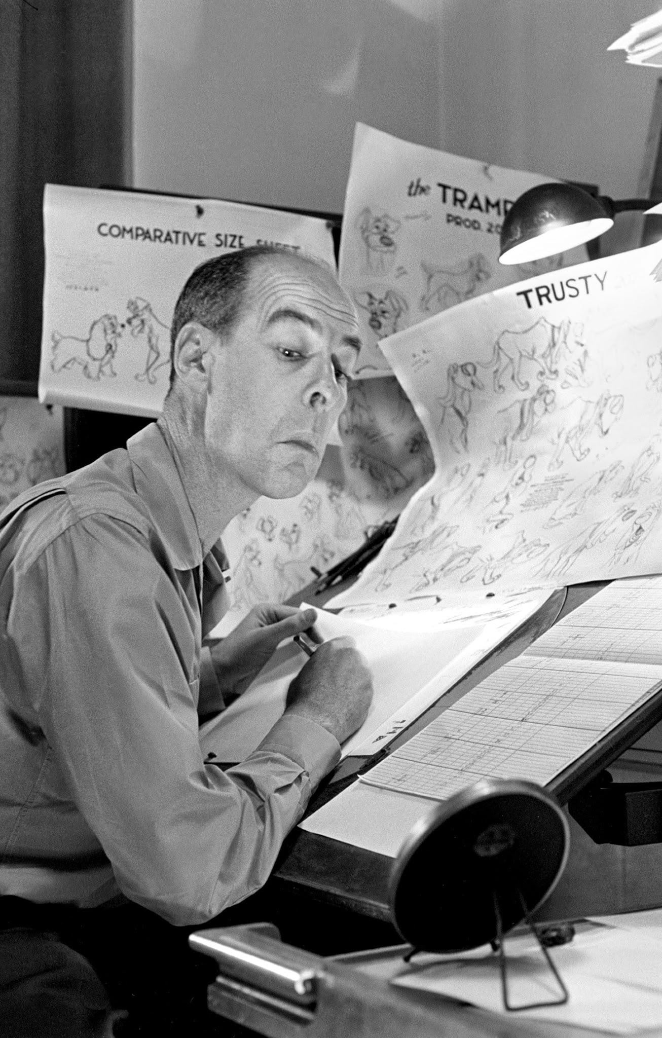 Disney animator peers in a mirror to get facial expressions just right, 1950s
